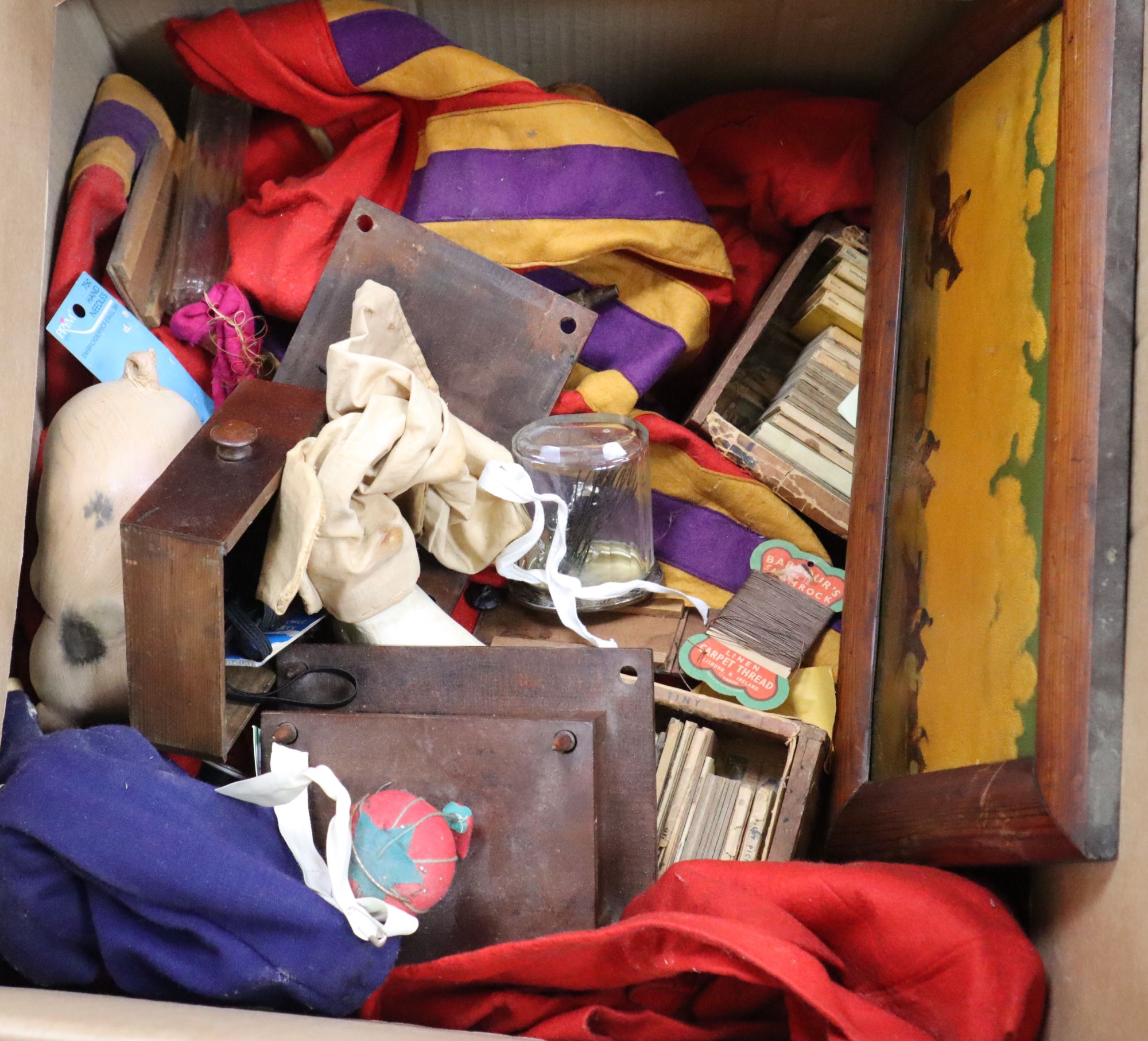 A group of Punch & Judy painted wood hand puppets other collectables and fabrics